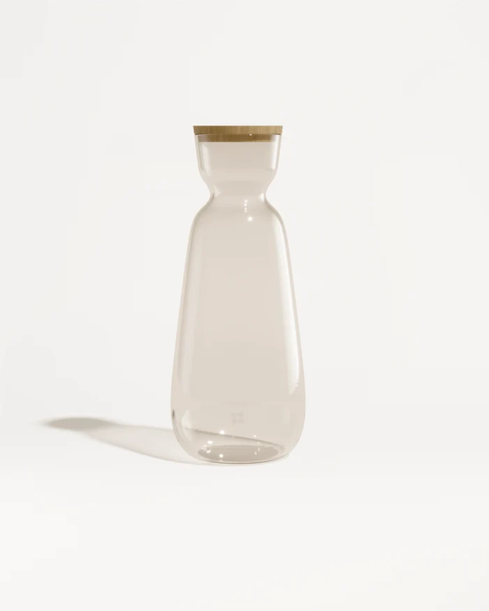 Grande Carafe en Verre with wooden lid in still life.