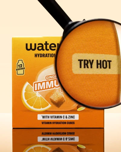 Boîte orange de cubes d'hydratation avec une loupe sur un cube orange.