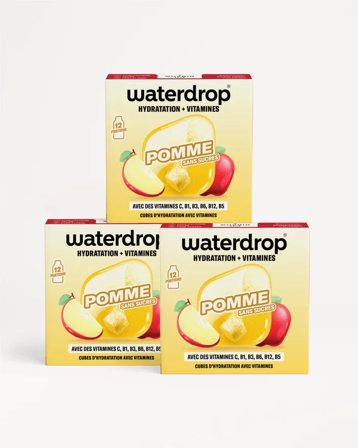 Trois boîtes Waterdrop Pomme hydrations et vitamines, empilées avec deux en bas et une en haut, avec des illustrations de pomme.